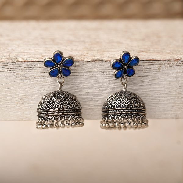 Champika- Silver Brass Stone Studded Jhumka Earrings(Blue)