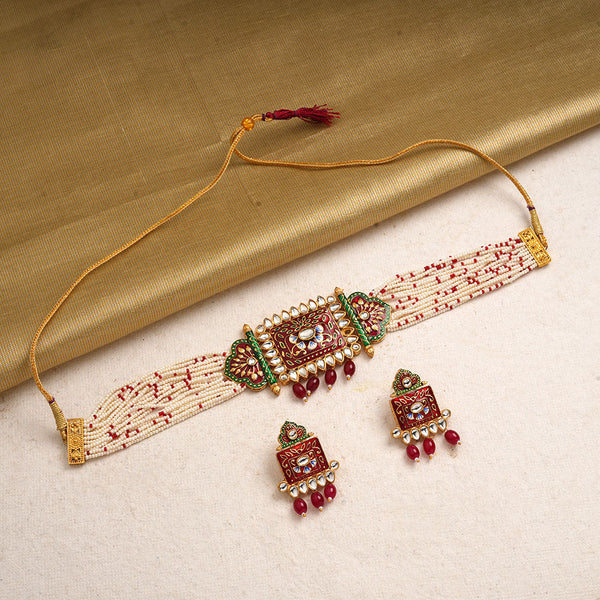 Ishani- Stone Studded Hanging Pearl Beaded Neckpiece Set (Red)