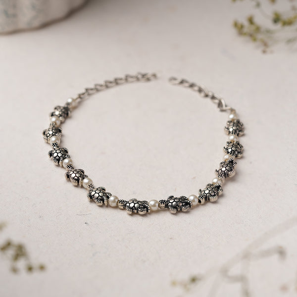 White Beads studded Tortoise Charm Bracelet
